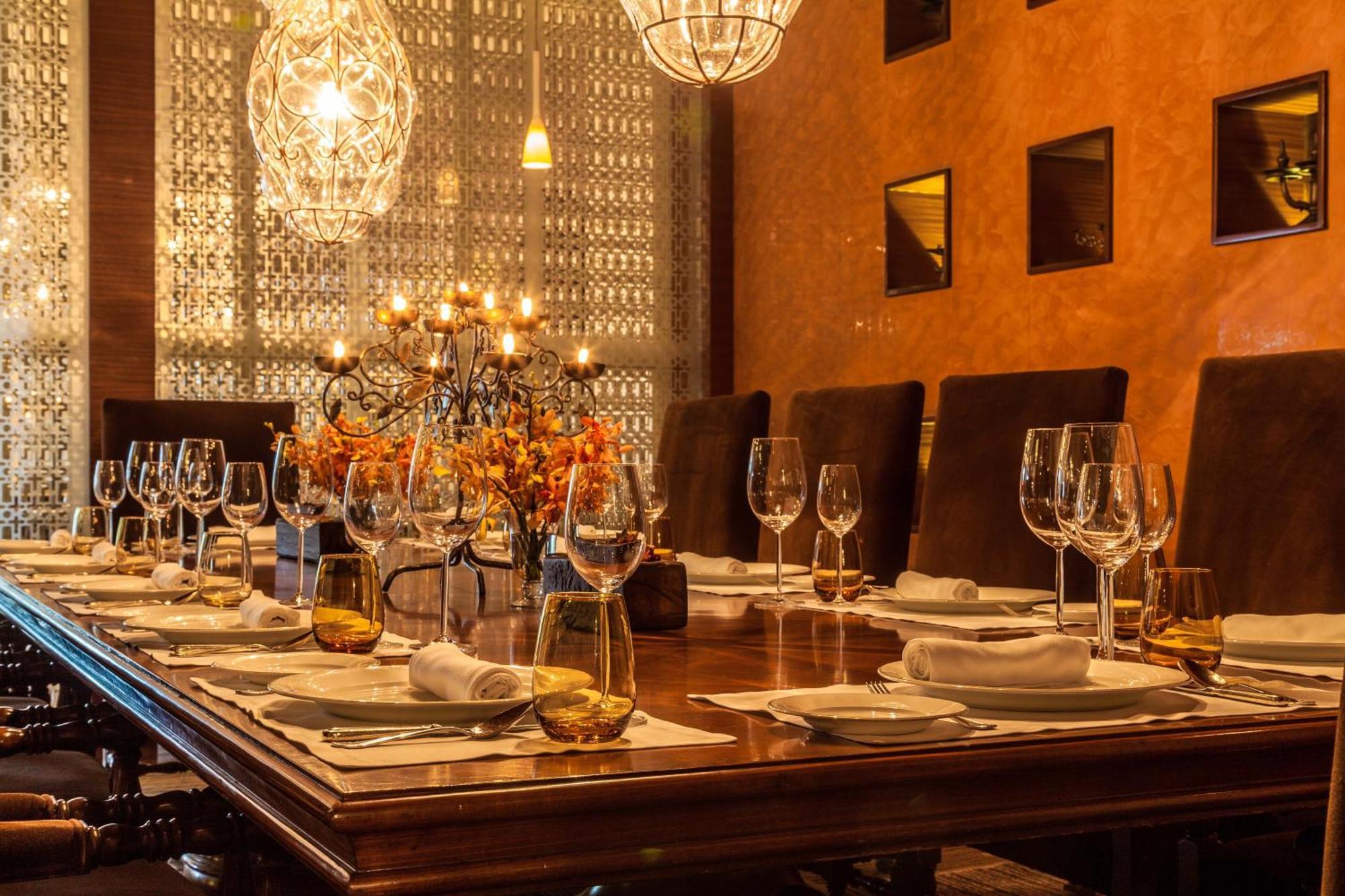 The Leela Ambience Gurugram Hotel & Residences - The Luxury Urban Sanctuary Гургаон Экстерьер фото A dining room table set for a meal